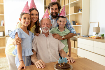 Family gathers for a birthday celebration at home