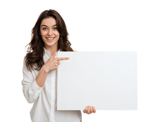 Fototapeta premium Attractive woman smiles and points to a blank white sign for your text.