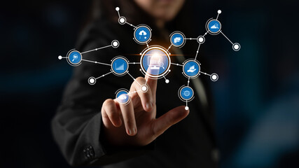 A business professional engages with a digital interface featuring various technology and finance icons, representing modern innovation and connectivity in a corporate environment. Tessel