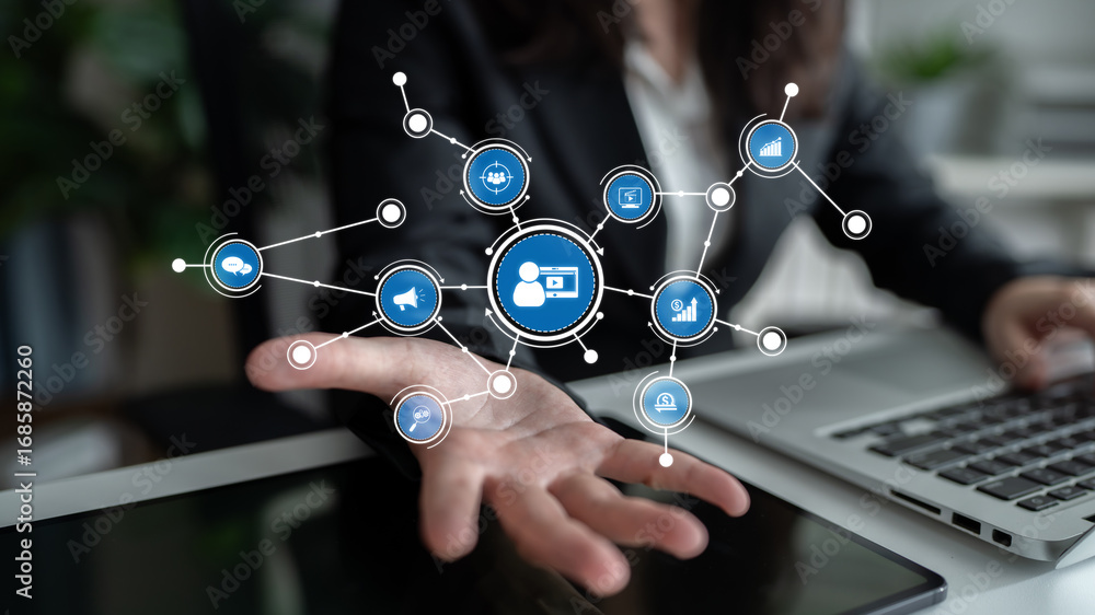 Aufkleber a businesswoman interacts with digital network symbols in a modern workspace, illustrating the conce