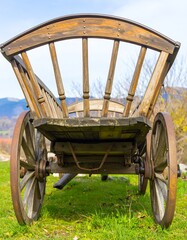Wooden wagon, rear view, on a grassy field
