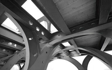 Intricate network of steel beams and concrete decking, showcasing modern architectural design.