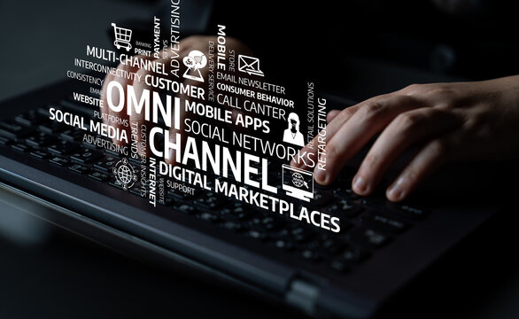 A close-up of hands typing on a laptop keyboard, surrounded by various digital marketing terms. The image captures the essence of modern business strategies and online engagement. Tessel