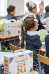 Russia. Saint Petersburg. Students raising their hands to answer.