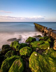 Coastal rocks, sea, pier, sunrise