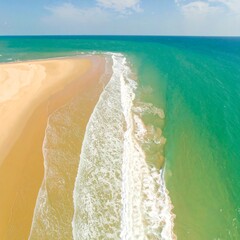 Coastal sandbar meets ocean waves