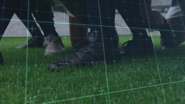 Pass entering players' legs cushioning ball while grid pulsing kicking toward camera during drill