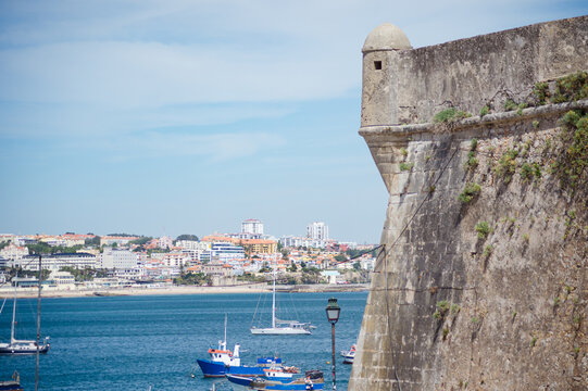 A vibrant summer view of a historic fortress by the coast, bathed in sunlight. Ideal for travel ads, cultural visuals, or luxury lifestyle content with a scenic, timeless appeal captured.