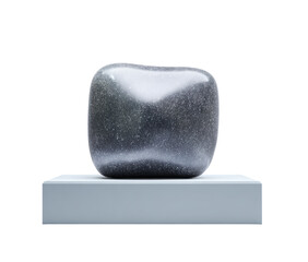 Gray, sculpted stone on light gray pedestal