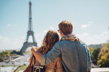 Tourists admiring eiffel tower in paris during summer vacation