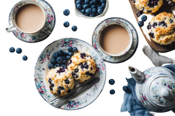 Vintage-style tea set with blueberry scones and tea.  