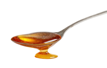 Honey in a small, shallow, footed spoon