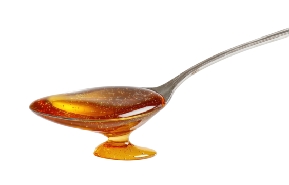 Honey in a small, shallow, footed spoon