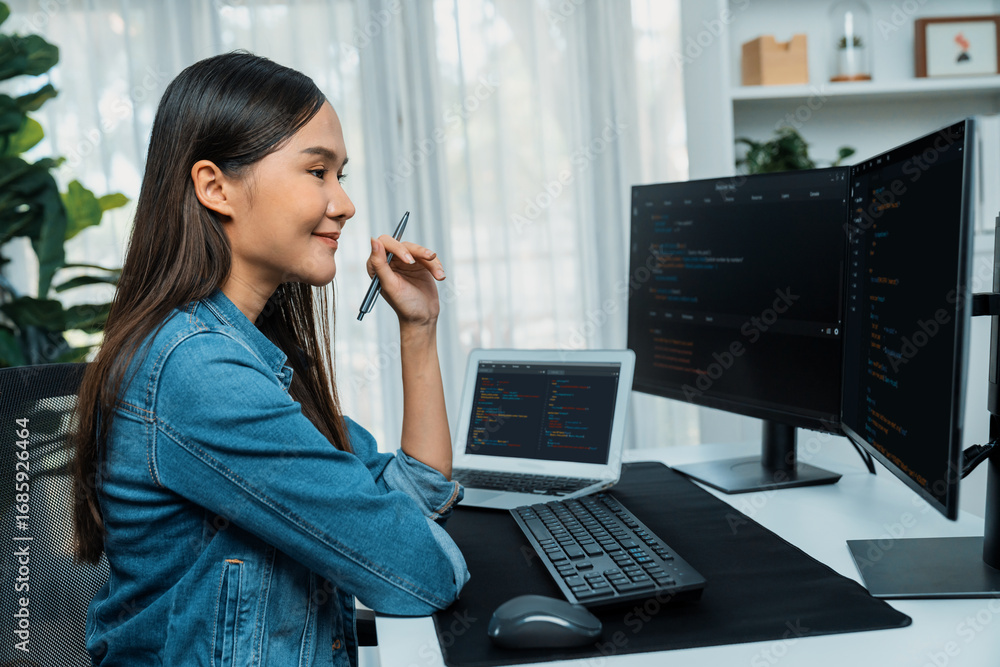 Poster young asian it developer looking online information on pc for beautiful pose with coding program dat
