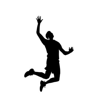 Athlete performing a powerful spike during a competitive volleyball match