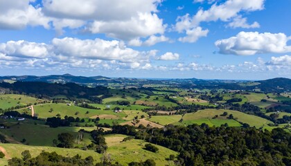 Obraz premium Panoramic view of rolling green hills and valleys