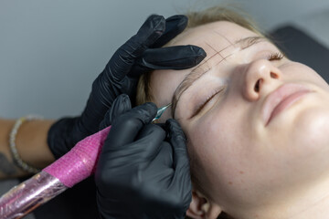 Eyebrow microblading session showcasing precision and artistry in a beauty studio