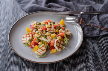 Salad with mozzarella cheese and oranges. 