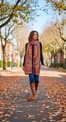 Attractive woman strolling down a tree-lined street covered in fallen leaves, wearing a colorful scarf, with houses visible in the background, embodying the autumn season .
