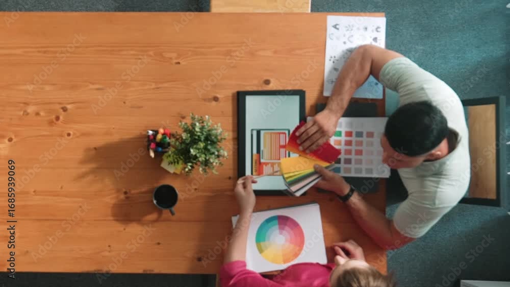 Poster top aerial view of business people working together to choosing color from color palette. manager pr