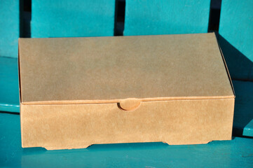 Cardboard box on a wooden bench