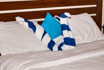 Typical bed decoration in an Egyptian hotel with an animal-shaped towel figure.
