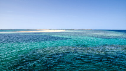 View of a sandbank in the Red Sea, Egypt, with clear shallow waters.
