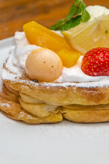 Delicious fruit-topped pancake breakfast ready to eat with vibrant colors and fresh ingredients