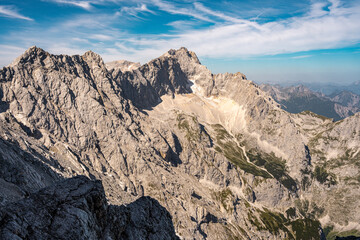 Scenic View Of Zugspitze And Jubilee Ridge From Via Ferrata Alpspitze: Rugged Rocky Peaks Of The Bavarian Alps Under Clear Blue Sky