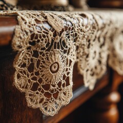 Intricate crochet lace doily on wooden surface