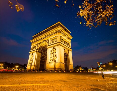 Illuminated Arc de Triomphe at night