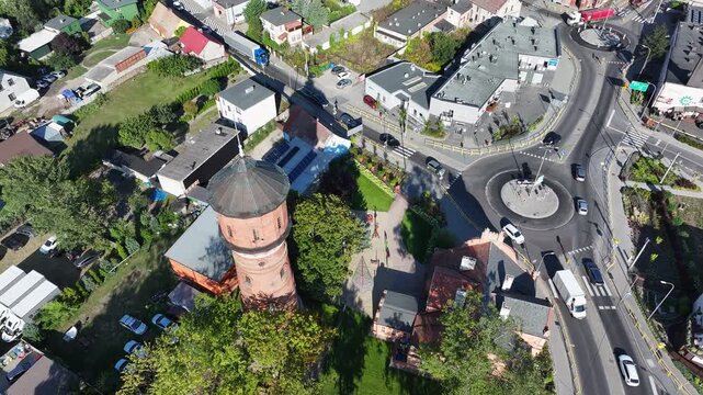 Aerial Strzelno Poland water tower overhead 2. Central north Poland. German occupation World War II. Farm rural area. Historical trade and religious center. Historic buildings rural village.