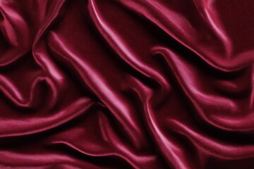 Obraz premium Luxurious red silk fabric with smooth waves and elegant texture