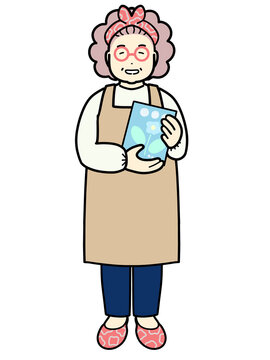 A woman holding a picture book