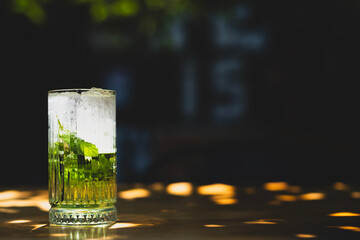Refreshing mojito cocktail with lime and mint. Cool refreshing mojito cocktail on table. Iced...