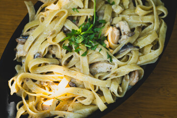 Italian fettuccine pasta with cream, chicken and mushrooms. Creamy chicken and mushroom fettuccine...
