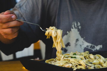 Italian fettuccine pasta with cream, chicken and mushrooms. Creamy chicken and mushroom fettuccine...