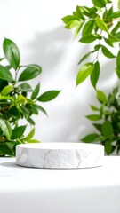 White marble pedestal surrounded by lush green foliage