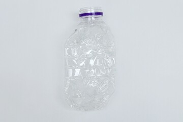 Plastic mineral water bottle waste on white background