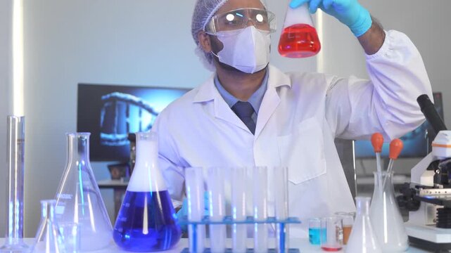 A chemist observes the endpoint of a titration in an Erlenmeyer flask, analyzing the colorimetric change of an indicator during a pharmaceutical quality control assay.