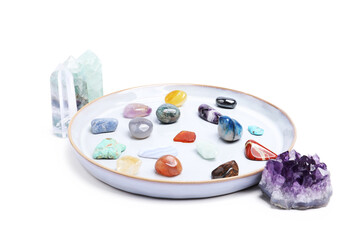 Many different healing stones isolated on white
