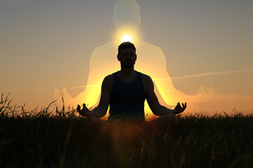 Man practicing meditation in nature. Sun above his head. Silhouette around - as aura