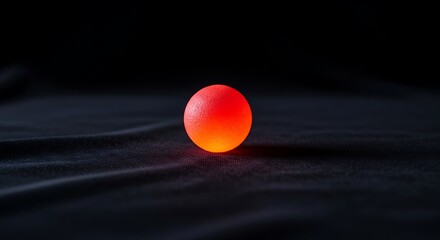 Eerie Glowing Sphere on Dark Fabric, A minimalist image with a mesmerizing contrast, perfect for enigmatic themes