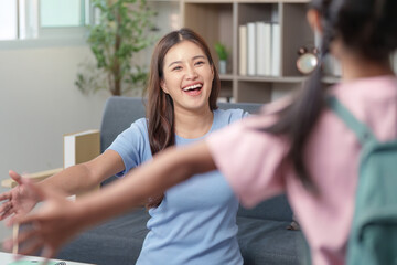 Joyful Mother welcoming child home after school