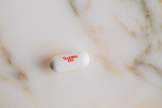 500 mg Tylenol white pill on marble 