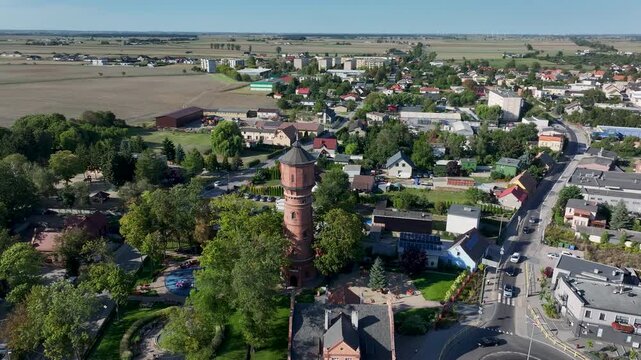 Aerial Strzelno Poland historic water tower city circle. Central north Poland. German occupation World War II. Farm rural area. Historical trade and religious center. Historic buildings rural village.