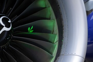 Sustainable Aviation: Green Leaf on Airplane Engine Turbine Blade
