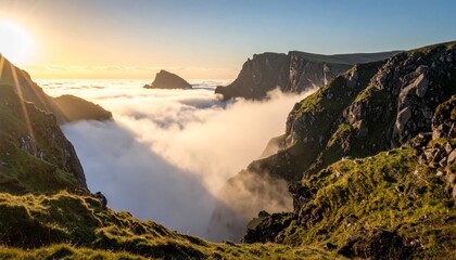 Fototapeta premium Breathtaking Sunrise Over Foggy Valley Amidst Rugged Mountain Cliffs