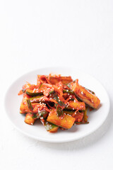 Korean kimchi cucumber on white plate, Korean side dish, Homemade food