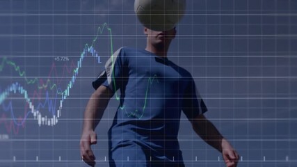 Male athlete lifting knee and juggling soccer ball while tech grid overlay animating analytics - Powered by Adobe